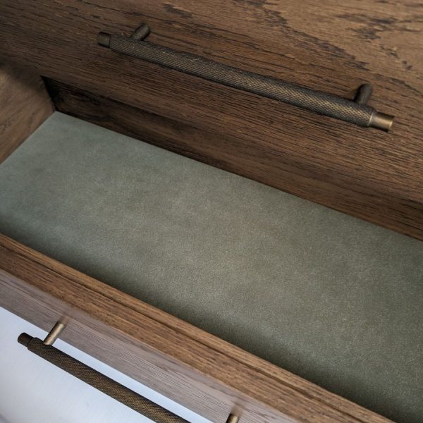 Wooden drawer with green felt lining and antique handles
